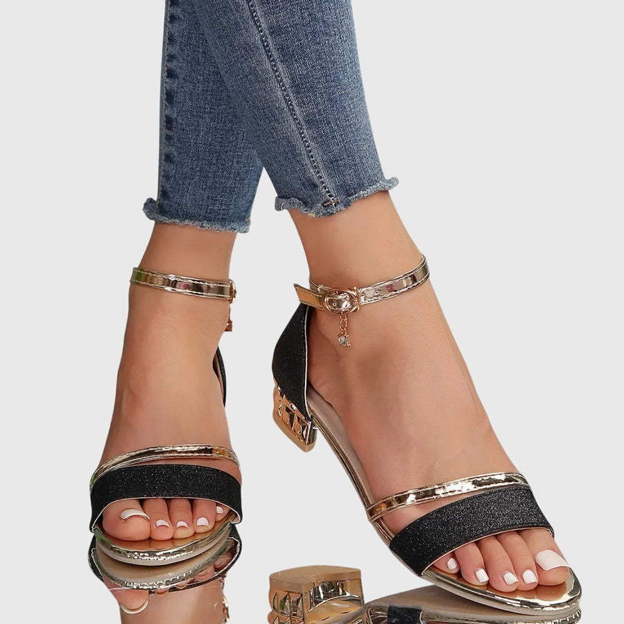Orthopedic heeled sandals with black glitter straps and gold-tone block heel, ankle buckle