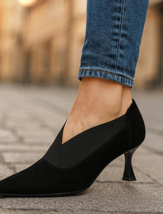 Black suede pointed-toe heeled pumps with slim heel and slip-on collar