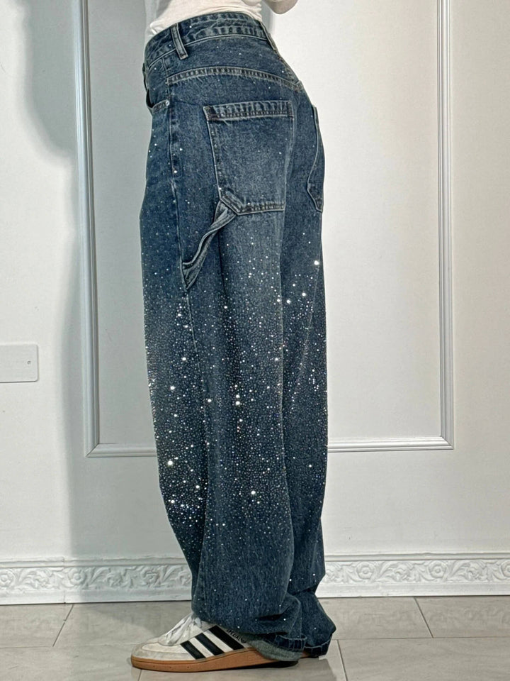 Dark indigo speckled denim trousers, wide-leg with back pockets and contrast stitching