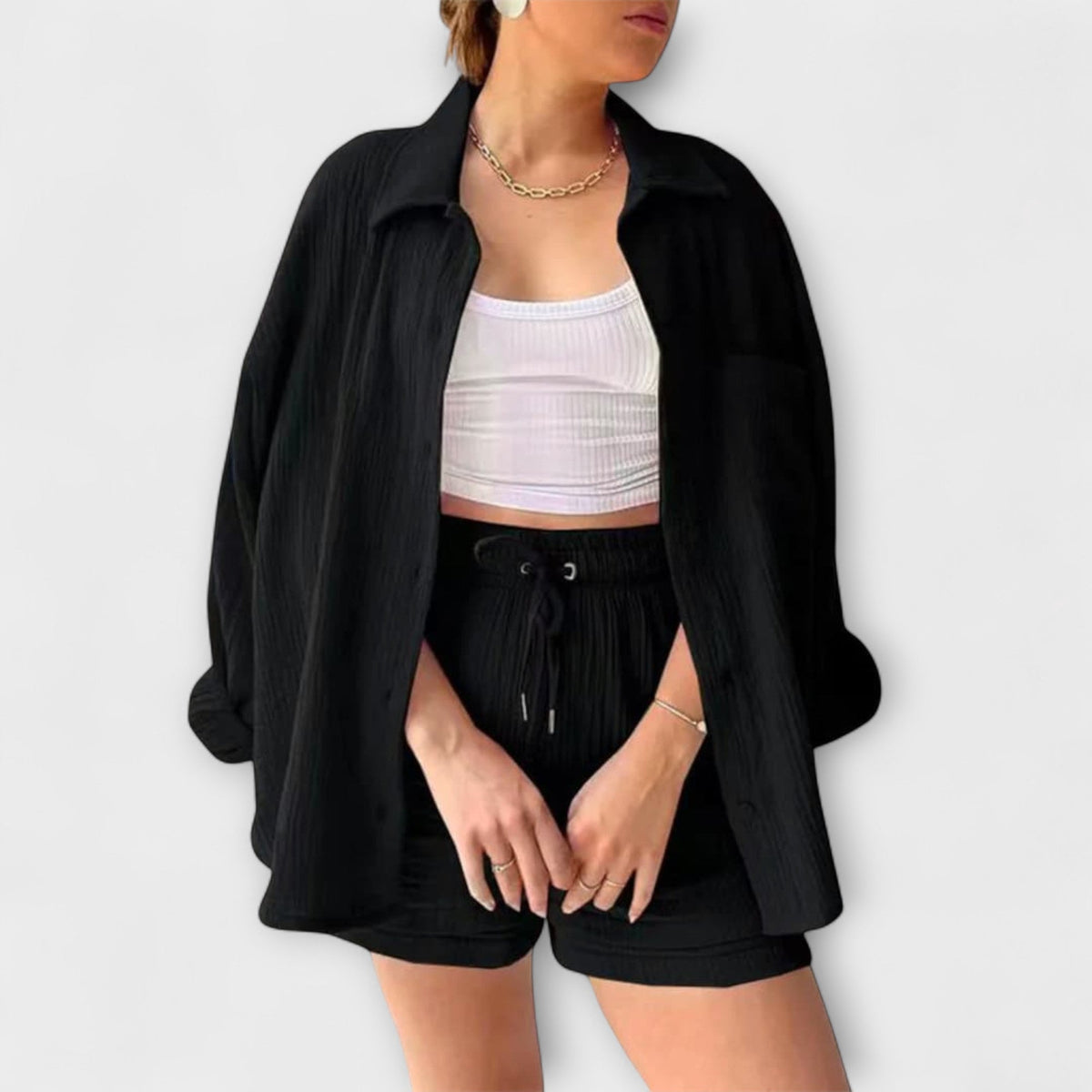 Black button-front top with drawstring shorts, matching two-piece set