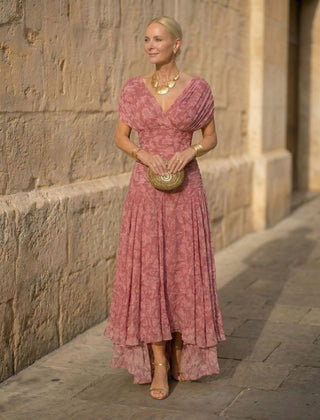 Pink V-neck flowing dress with short sleeves and layered skirt