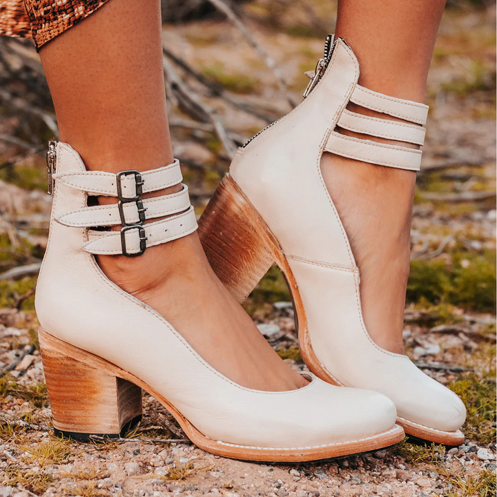 White ankle strap heeled sandals with buckled straps and wood-look block heel