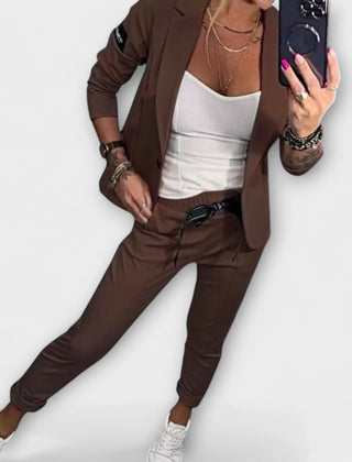 Brown blazer and pants set with white camisole top, tailored fit, 3/4 sleeves.