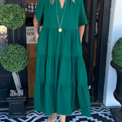 Green tiered maxi dress with short sleeves and V-neck, relaxed fit