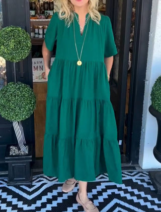 Green tiered maxi dress with short sleeves and V-neck, relaxed fit