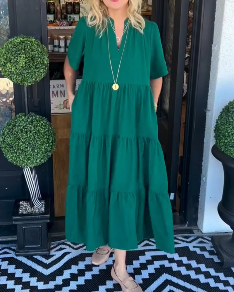 Green tiered maxi dress with short sleeves and V-neck, relaxed fit
