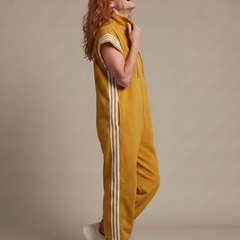 Mustard yellow sleeveless zip jumpsuit with white side stripe panels and hood