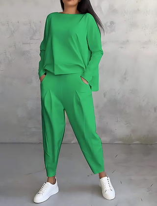 Green two-piece lounge set with long-sleeve sweatshirt and tapered ankle jogger pants