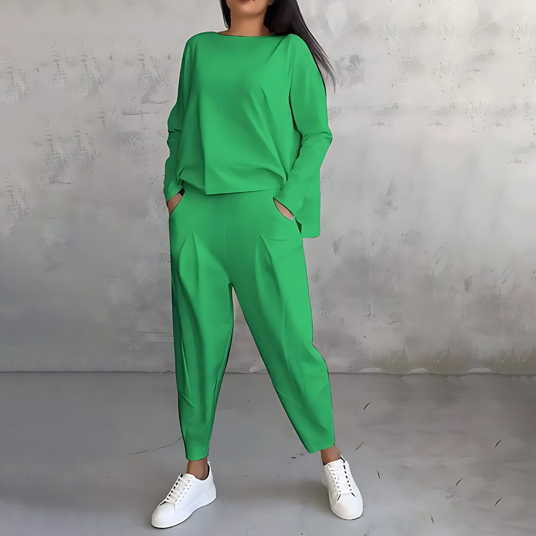 Green two-piece lounge set with long-sleeve sweatshirt and tapered ankle jogger pants