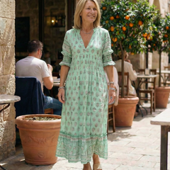 Green floral tiered midi dress with V-neck and short puff sleeves