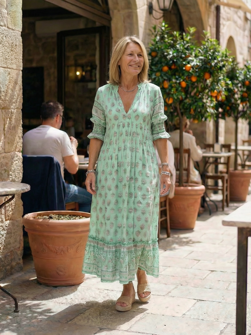 Green floral tiered midi dress with V-neck and short puff sleeves