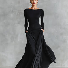 Black long-sleeve maxi dress with ruched waist and draped side skirt