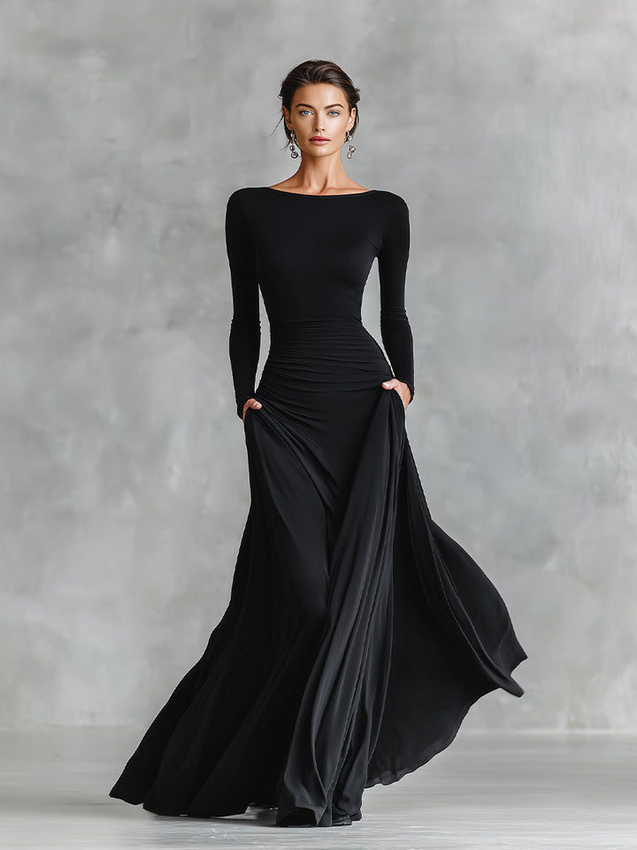 Black long-sleeve maxi dress with ruched waist and draped side skirt
