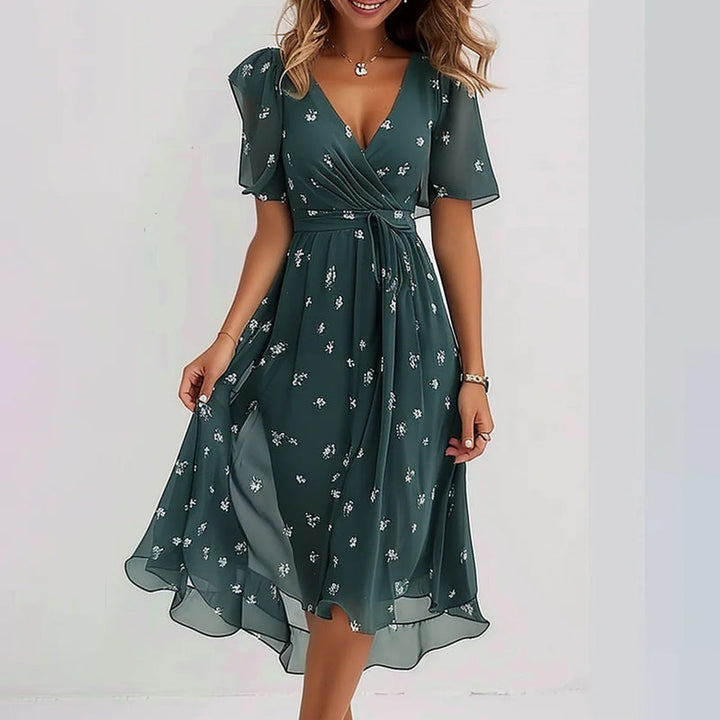 Dark green floral summer dress with white print, V-neck, short sleeves, gathered midi skirt