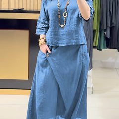 Blue two-piece outfit: long-sleeve tunic and gathered midi skirt with pockets