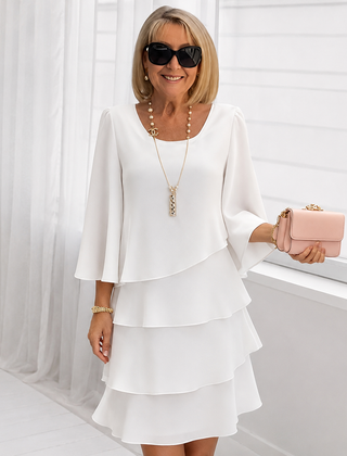 White ruffle tiered dress with flared sleeves and square neckline