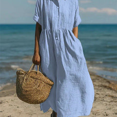 Light blue collared button dress with short sleeves and gathered waist