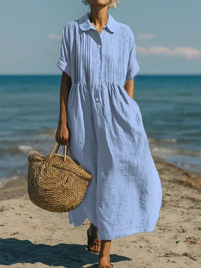 Light blue collared button dress with short sleeves and gathered waist