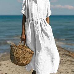 White collared button dress with short sleeves and gathered waist