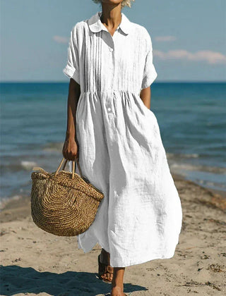 White collared button dress with short sleeves and gathered waist