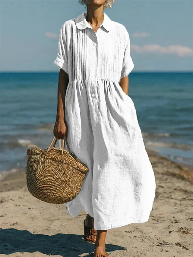 White collared button dress with short sleeves and gathered waist