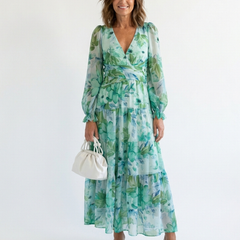 Green floral maxi dress with V-neck, long puff sleeves, tiered skirt, cinched waist