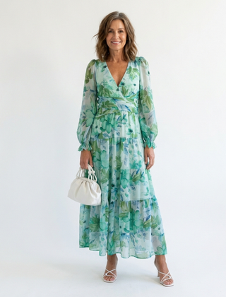 Green floral maxi dress with V-neck, long puff sleeves, tiered skirt, cinched waist