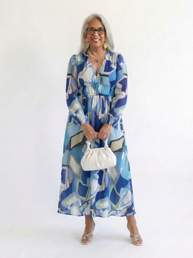 Blue abstract print long sleeve maxi dress with V-neck, gathered waist, tiered skirt