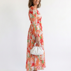 Althea long-sleeve floral maxi dress, side view, gathered waist and tiered hem, orange