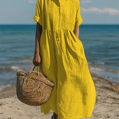 Yellow collared button dress with short sleeves and gathered waist