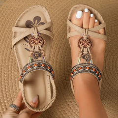 Boho comfort sandals in beige with bow ankle straps and ornate charm bead trim