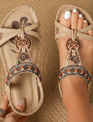 Boho comfort sandals in beige with bow ankle straps and ornate charm bead trim
