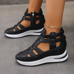 Black orthopedic comfort sandals with double adjustable straps, open toe, and cushioned sole