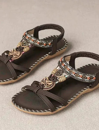 Dark brown boho flat sandals with wide straps and beaded trim, open-toe