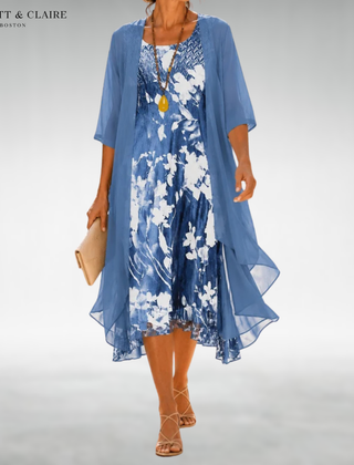 Blue floral midi dress with sheer short-sleeve overlay, scoop neckline, flowy hem