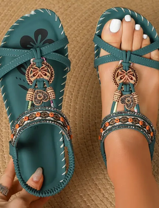 Boho comfort sandals in teal with bow ankle straps and ornate charm bead trim