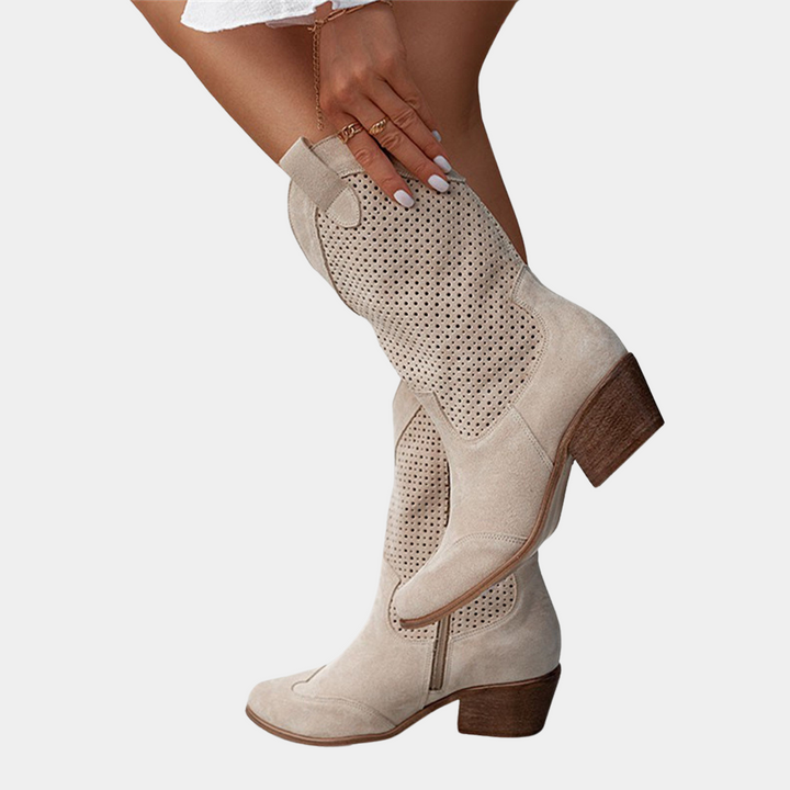 Beige cowboy orthopedic boots with perforated panels and chunky brown heel