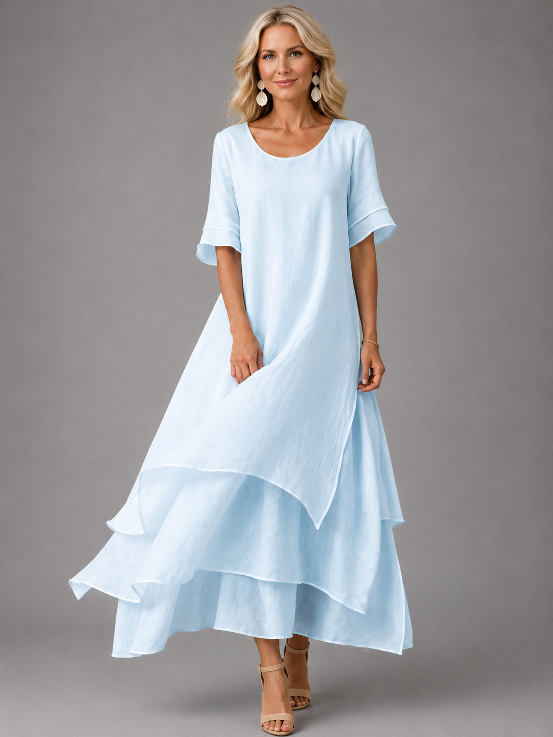 Women's light blue tiered maxi dress with short sleeves and layered ruffle hem
