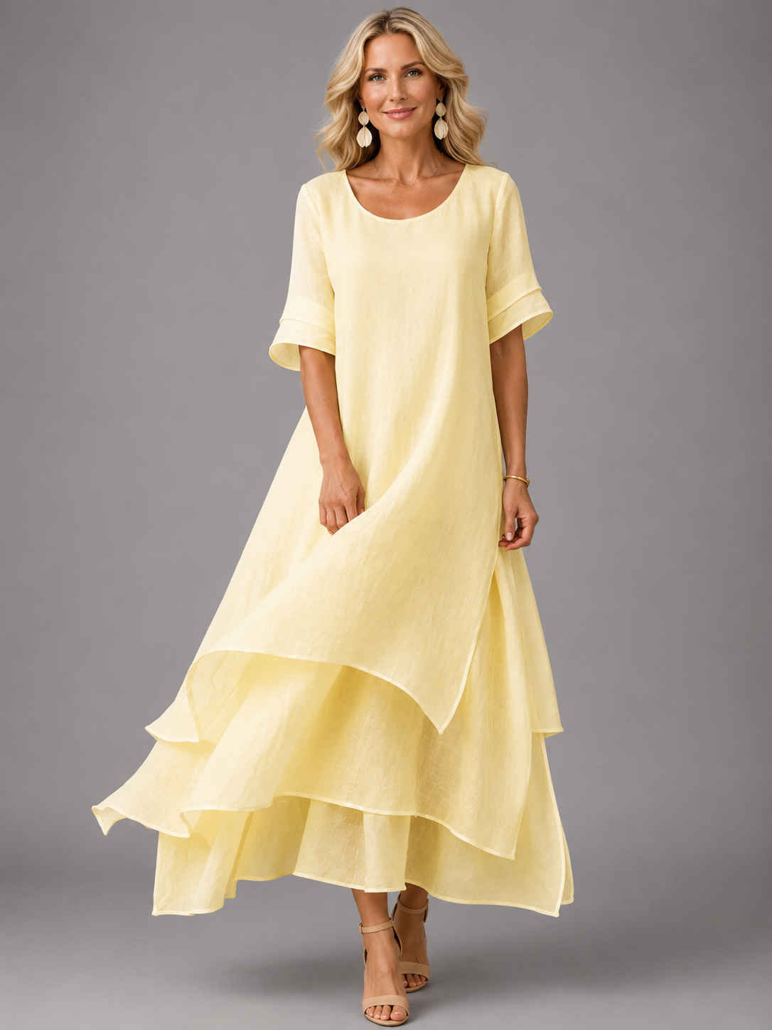 Women's pale yellow tiered maxi dress with short sleeves and layered ruffle hem