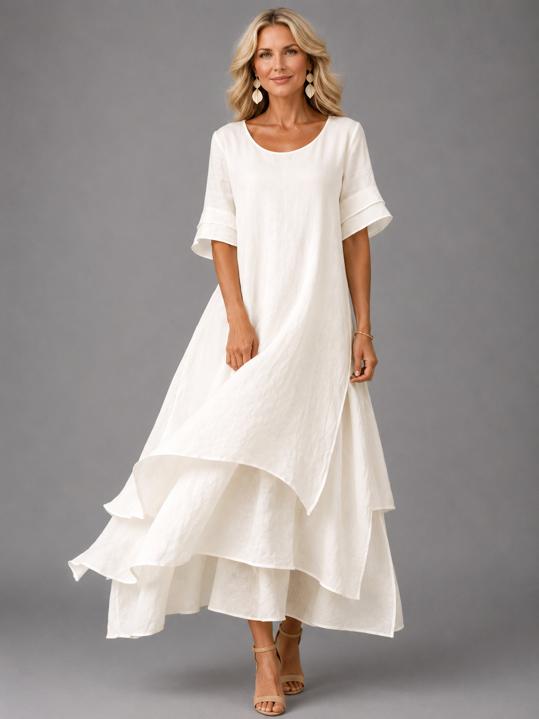 Women's white tiered maxi dress with short sleeves and layered ruffle hem