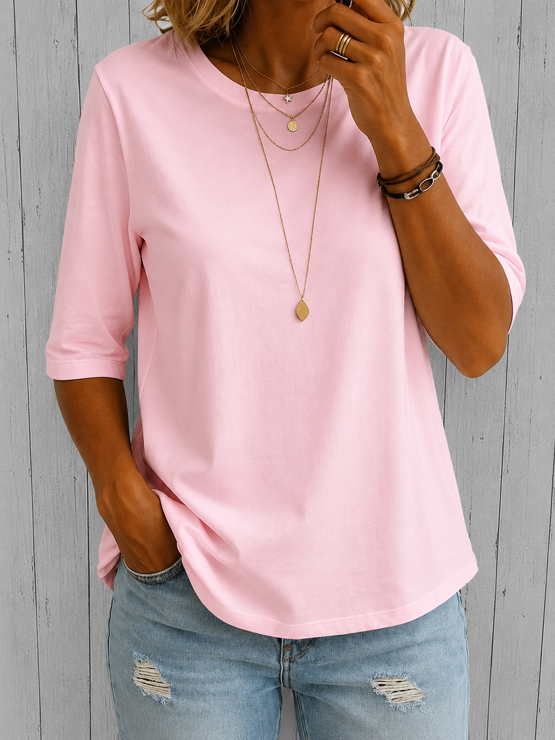 Pink crewneck comfort tee with 3/4 sleeves and draped fit