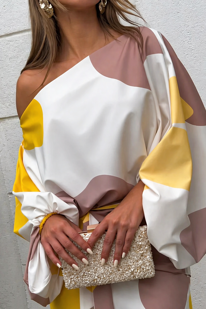 Off-shoulder glamour dress top with white, yellow, and mauve color blocks, satin drape