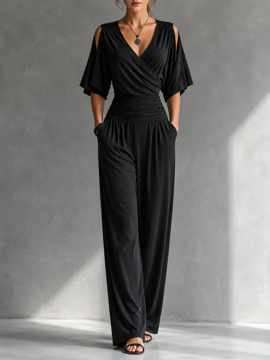 Black wrap V-neck jumpsuit with ruched waist and flowy wide-leg trousers