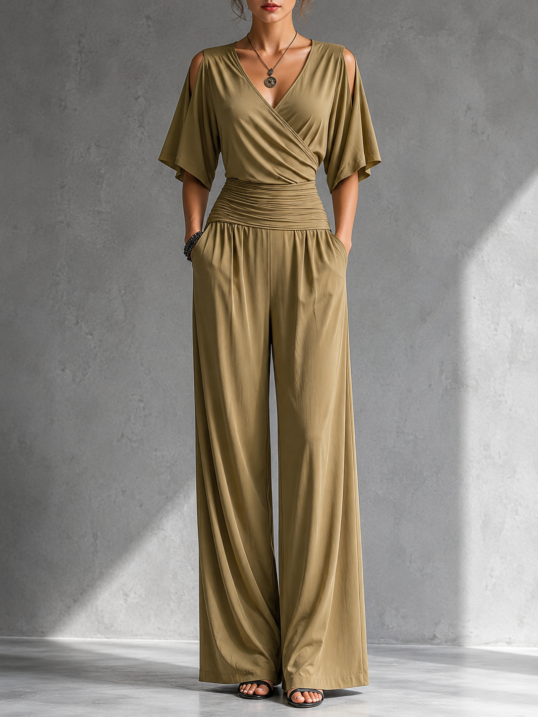 Khaki wrap V-neck jumpsuit with draped bodice, ruched waist, and wide-leg fit