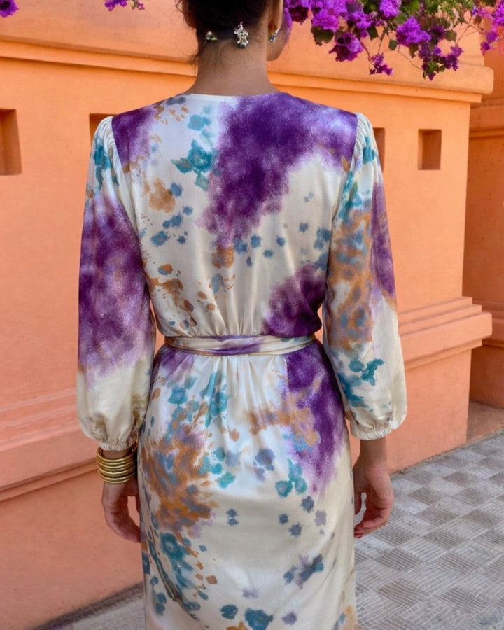 Back view watercolor print maxi dress with tie waist and long balloon sleeves.