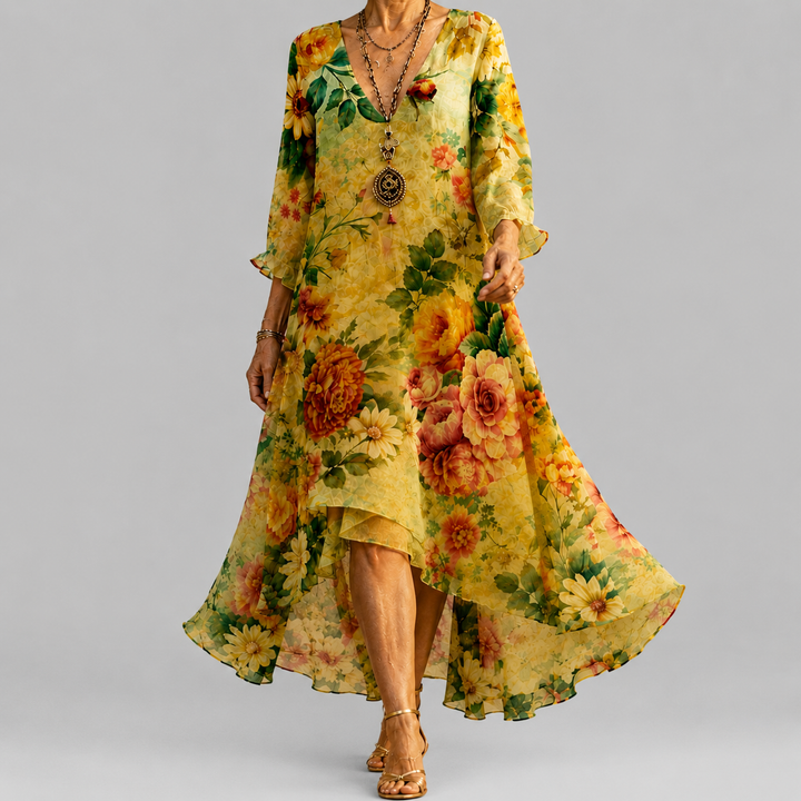 Floral midi dress in yellow with V-neck, three-quarter sleeves, and flowing asymmetric hem