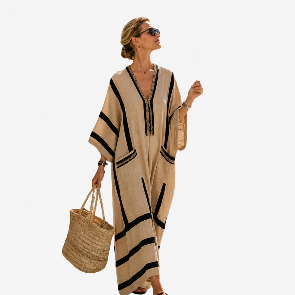 Long caftan in beige with black trim, V neckline and tassel, wide sleeves.
