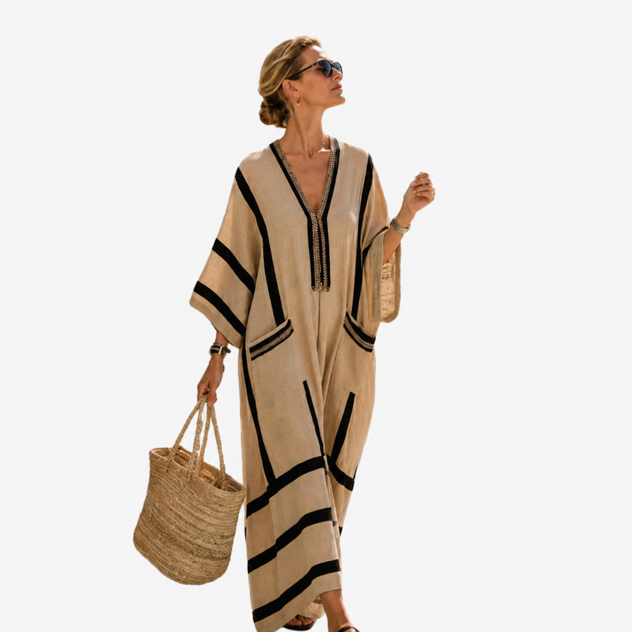 Long caftan in beige with black trim, V neckline and tassel, wide sleeves.