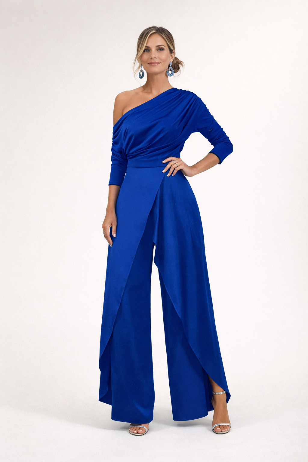 Royal blue one-shoulder draped jumpsuit with long sleeves and flowing wide-leg pants