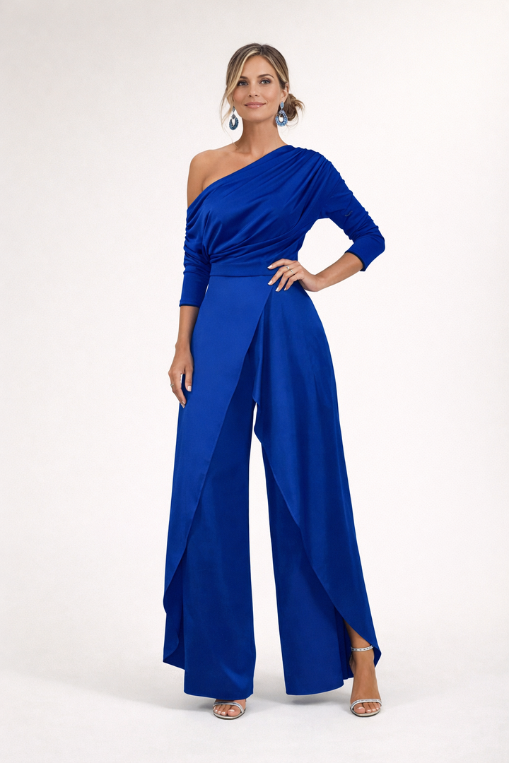 Royal blue one-shoulder draped jumpsuit with long sleeves and flowing wide-leg pants